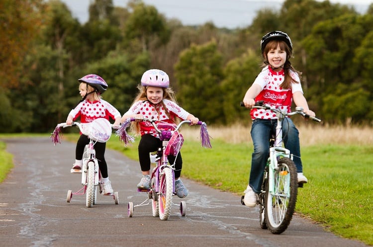 Three Young Girls Cycling