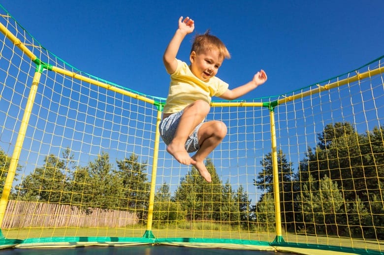 little boy jumping high