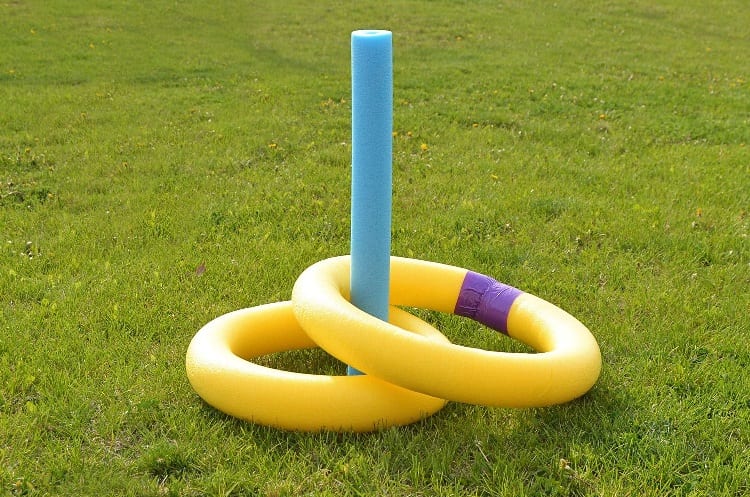 playing pool noodle with ring toss