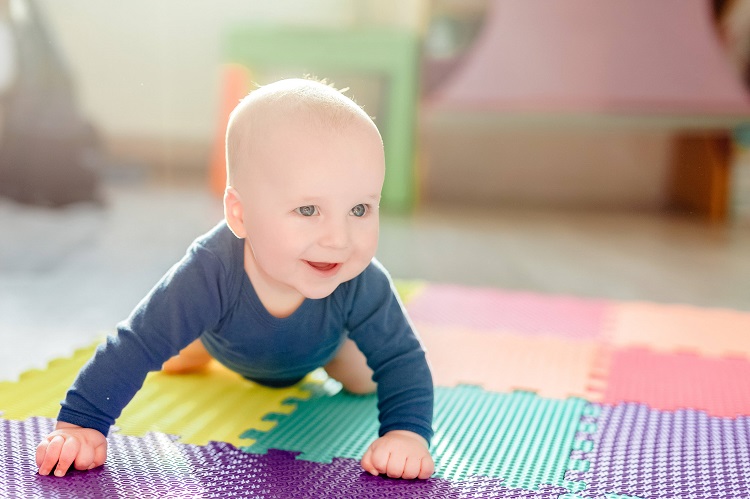 Little Baby Playing On Play Mat